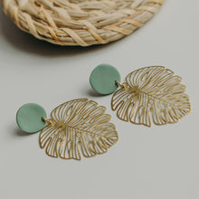 Load image into Gallery viewer, Brass Monstera Leaf Statement Earrings with Green Accent Stud. More Colours available.
