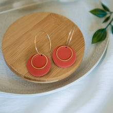 Load image into Gallery viewer, Lolita in TERRACOTTA, a Matte Disc on a 24 karat Gold-Plated Hoop. Choice of 5 charms.
